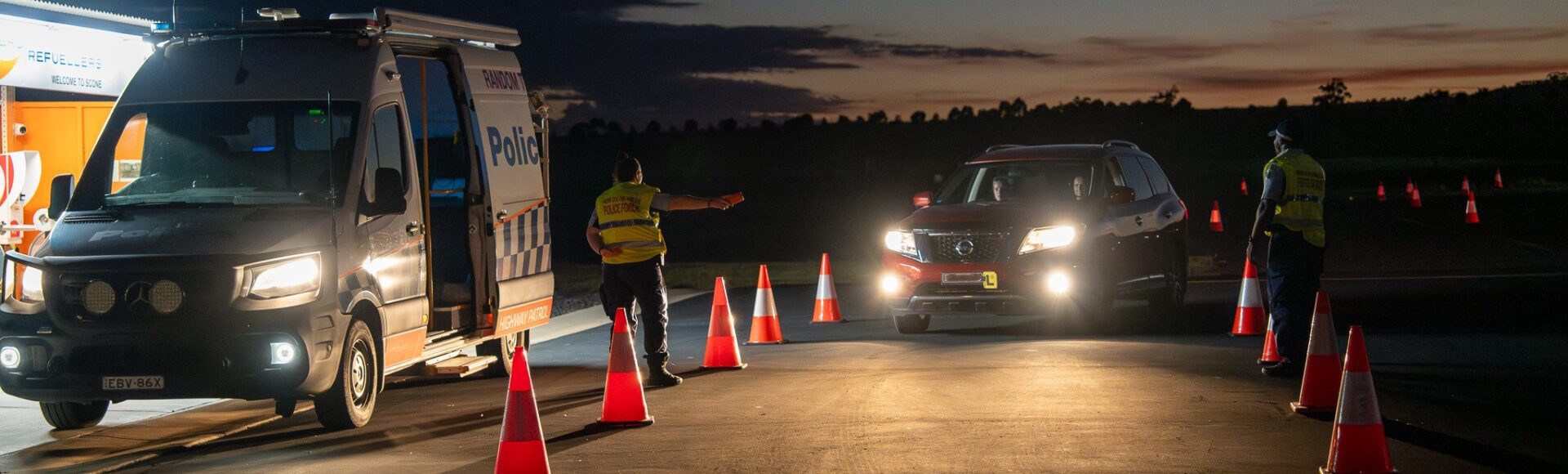NSW Police officers waving learner driver into random breath testing practice setup